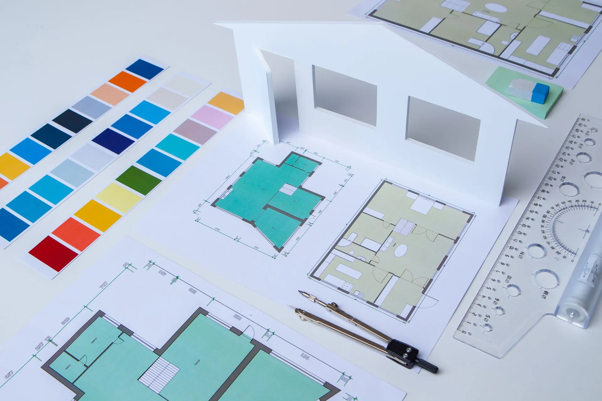 Project plans and color palettes laid out on a desk